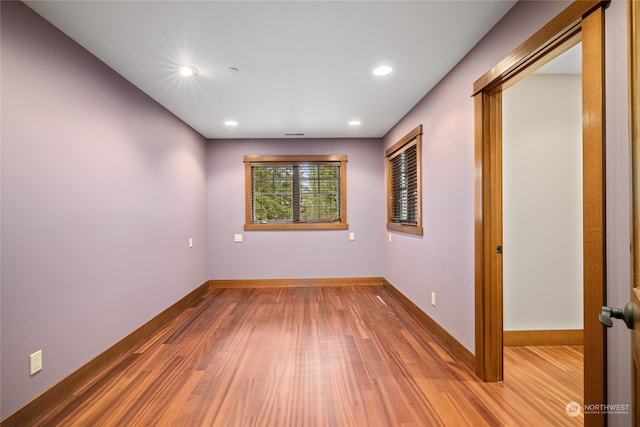 empty room with wood-type flooring