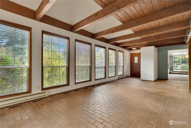unfurnished sunroom featuring baseboards, a baseboard heating unit, beam ceiling, and brick floor
