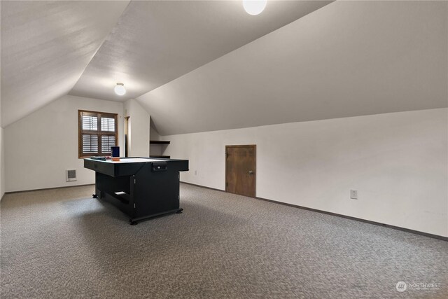 playroom featuring baseboards, carpet, vaulted ceiling, and visible vents