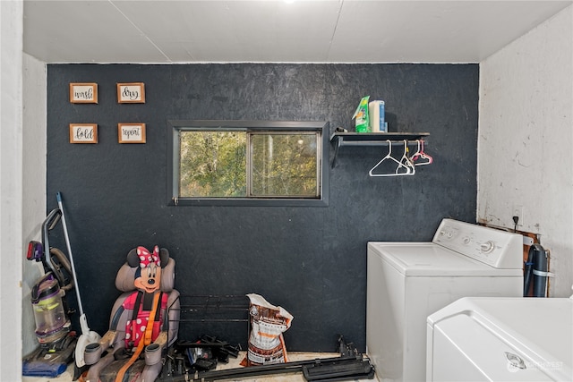 clothes washing area with washer and dryer