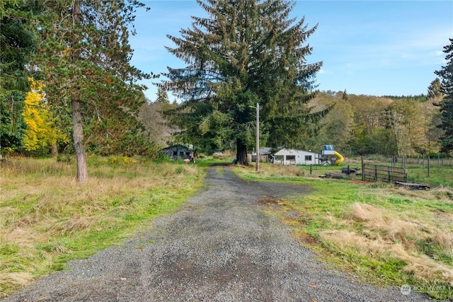 view of street with a mountain view and a rural view