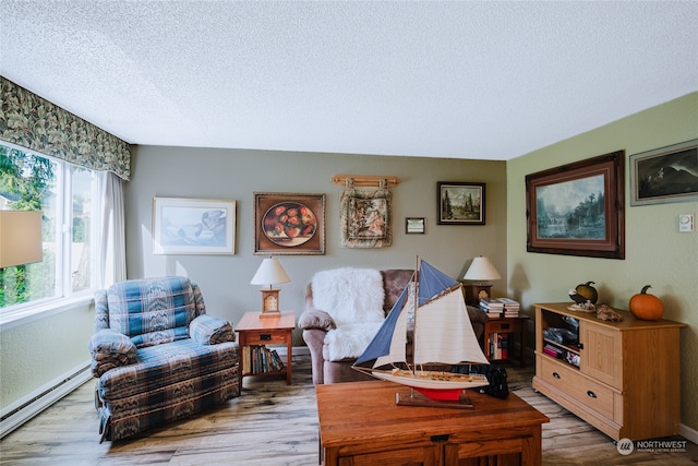 living room with hardwood / wood-style floors, a textured ceiling, and a baseboard radiator