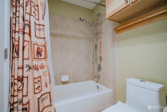 bathroom with shower / tub combo and toilet