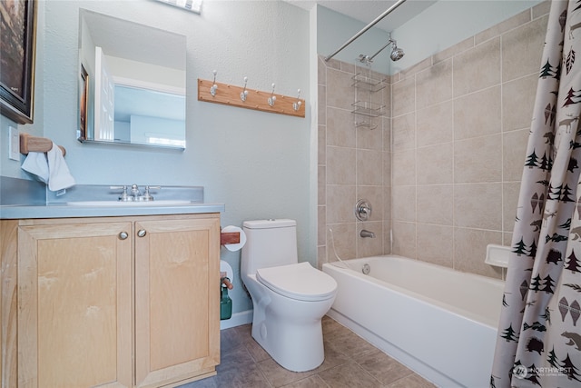 full bathroom featuring tile patterned floors, vanity, toilet, and shower / bathtub combination with curtain