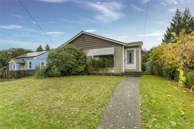 bungalow with a front yard