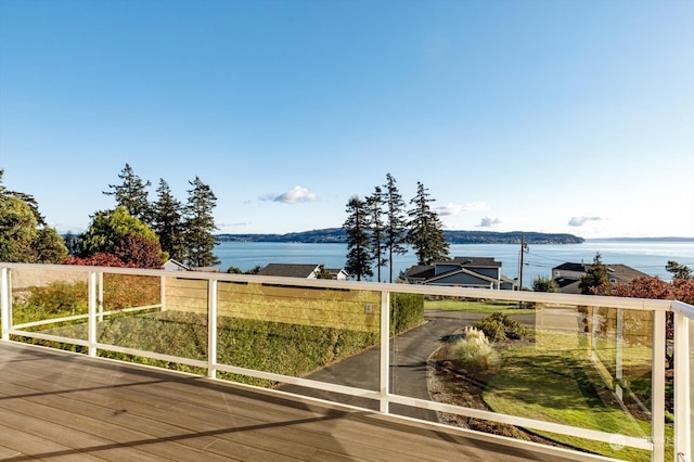 wooden deck featuring a water view