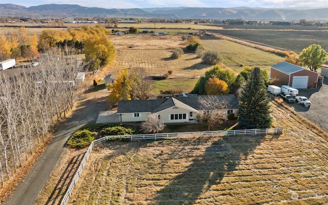 drone / aerial view featuring a rural view and a mountain view