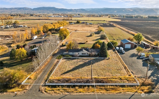 birds eye view of property with a mountain view and a rural view