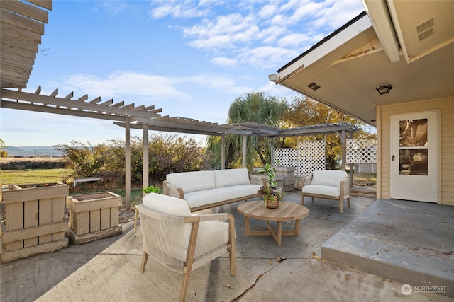 view of patio featuring outdoor lounge area and a pergola