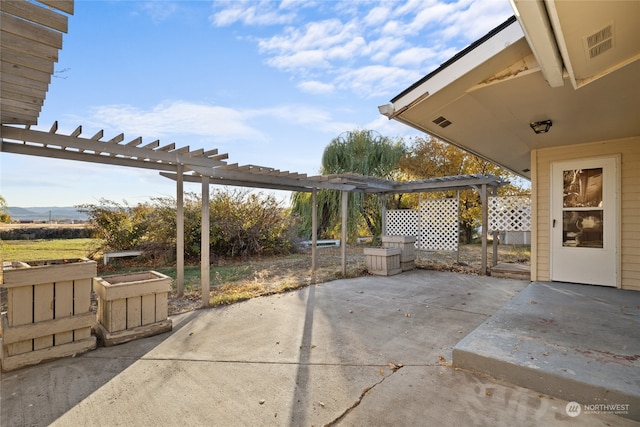 view of patio featuring a pergola