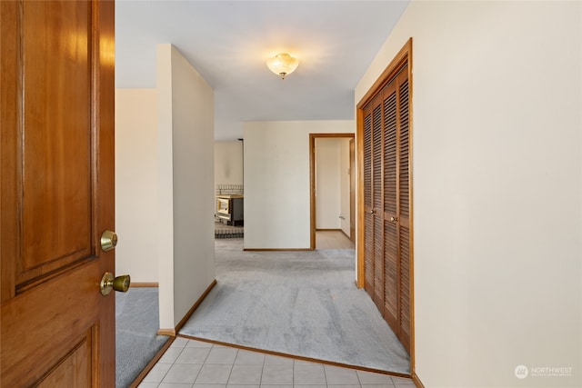 hallway featuring light carpet