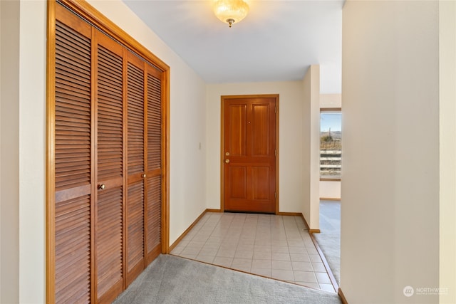 corridor with light tile patterned flooring