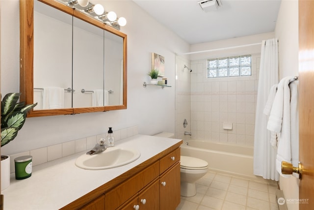 full bathroom with vanity, shower / bath combination with curtain, and toilet