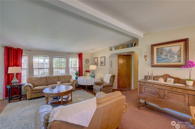 living room with light colored carpet and lofted ceiling with beams