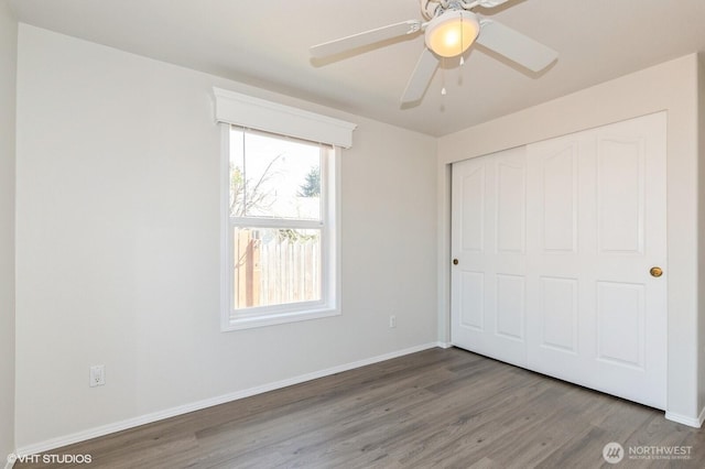 713 Main St, South Cle Elum, WA 98943 - unfurnished bedroom with wood finished floors, baseboards, a closet, and a ceiling fan