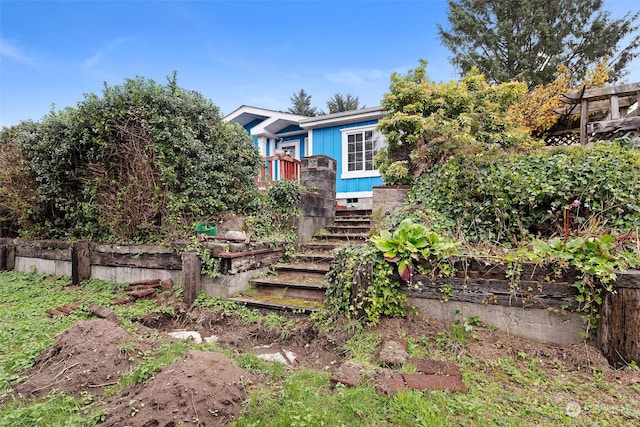 view of property hidden behind natural elements