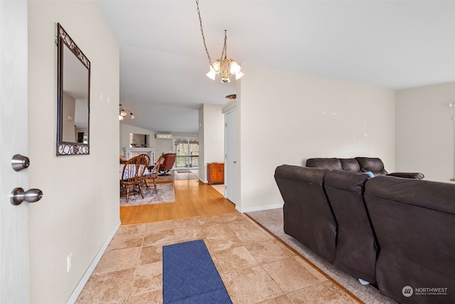 living room with hardwood / wood-style flooring and a chandelier