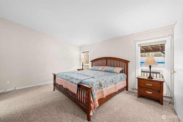 bedroom with light colored carpet