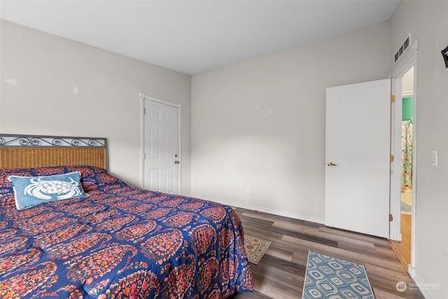 bedroom featuring hardwood / wood-style flooring