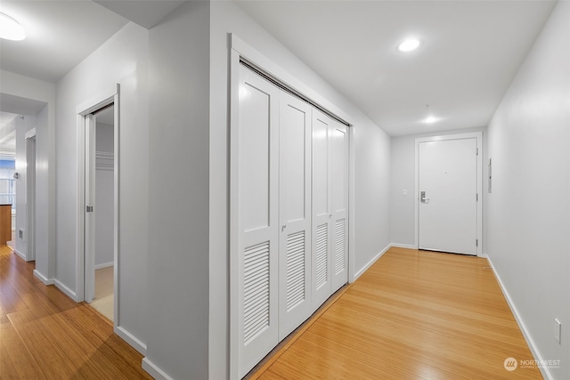 hallway with wood-type flooring