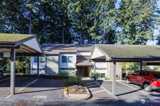 view of vehicle parking with a carport