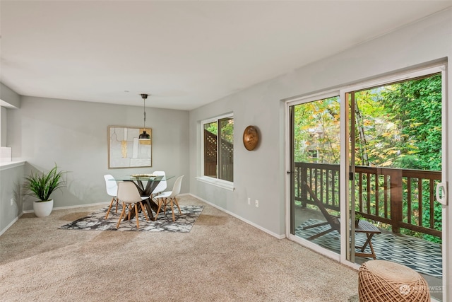 view of carpeted dining area