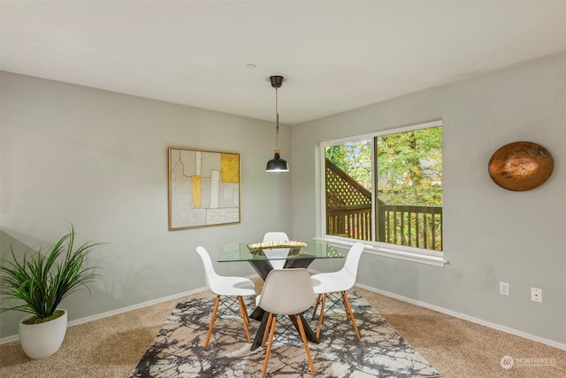 view of carpeted dining space