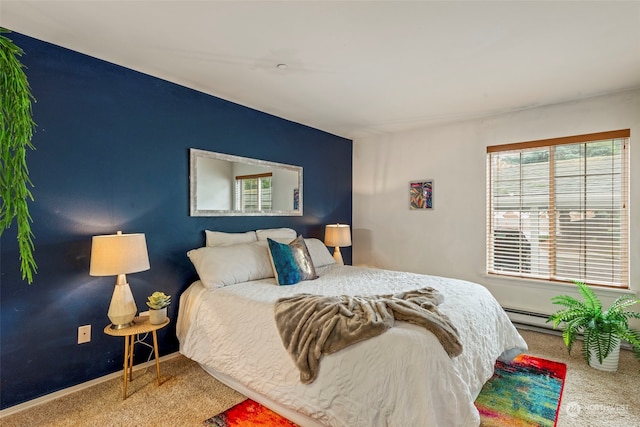 carpeted bedroom with baseboard heating