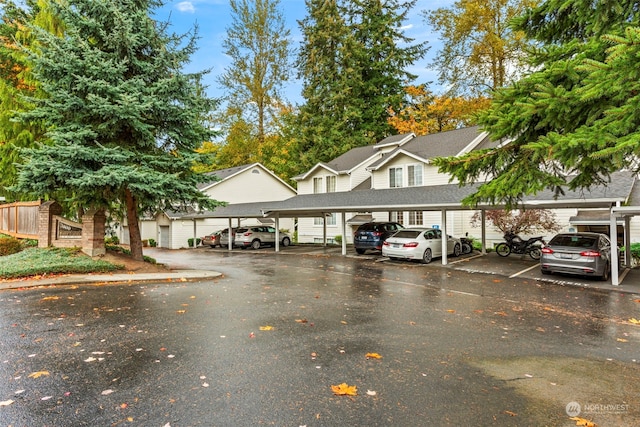 view of parking / parking lot with a carport