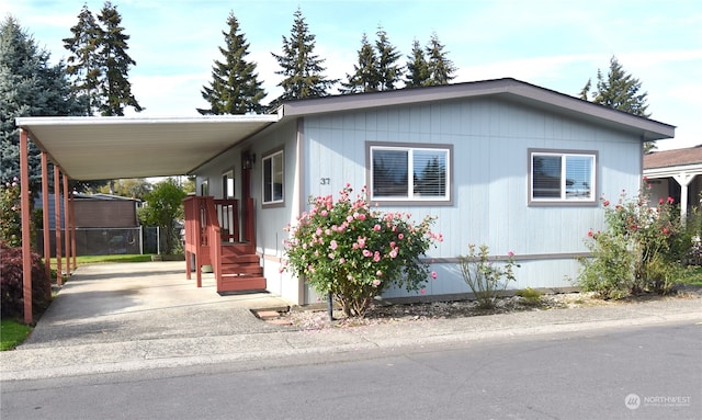 manufactured / mobile home featuring a carport