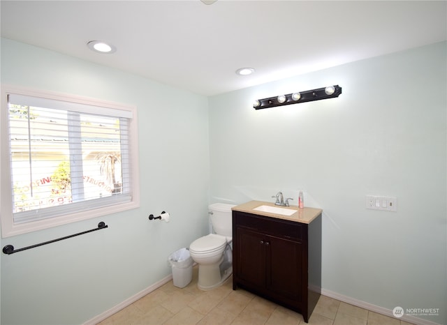 bathroom with vanity, toilet, and tile patterned floors