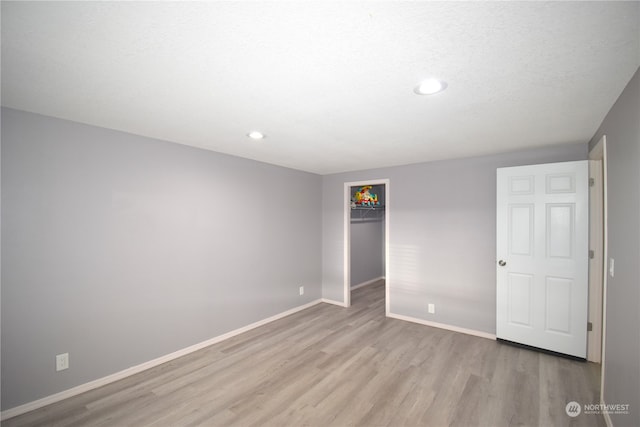 unfurnished bedroom featuring light hardwood / wood-style floors