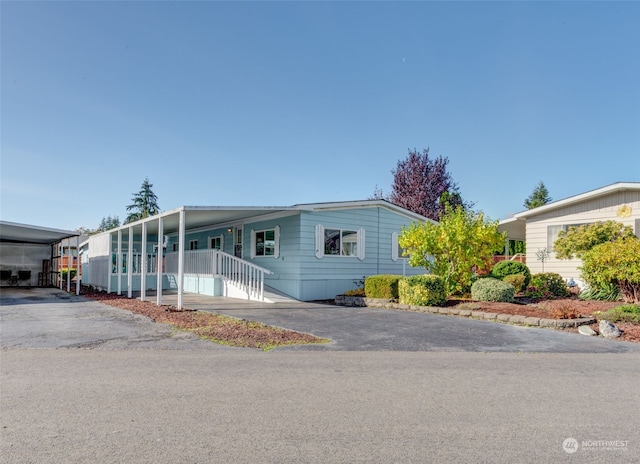 view of front of property with a carport