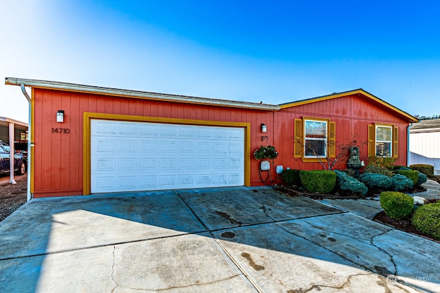 ranch-style home featuring a garage