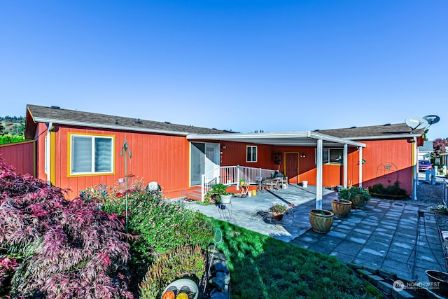 rear view of property featuring a patio