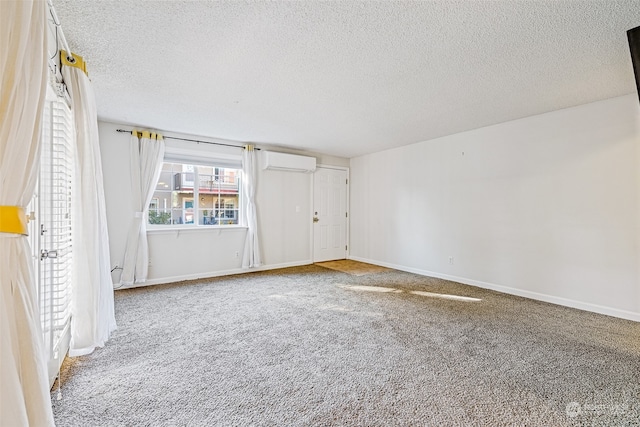 unfurnished bedroom featuring a textured ceiling, a wall mounted AC, and carpet floors