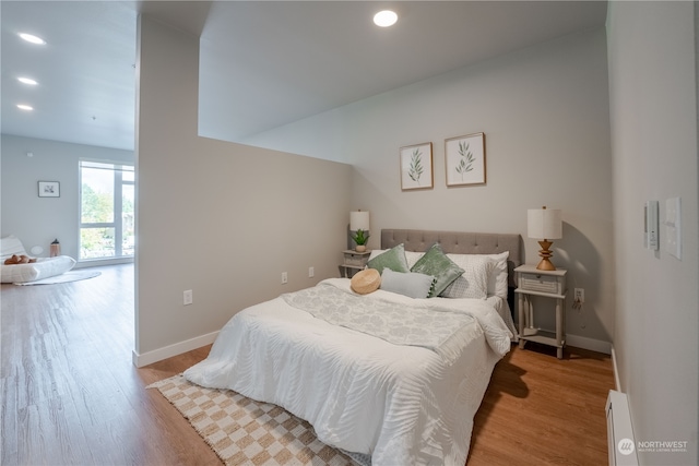 bedroom with light hardwood / wood-style flooring