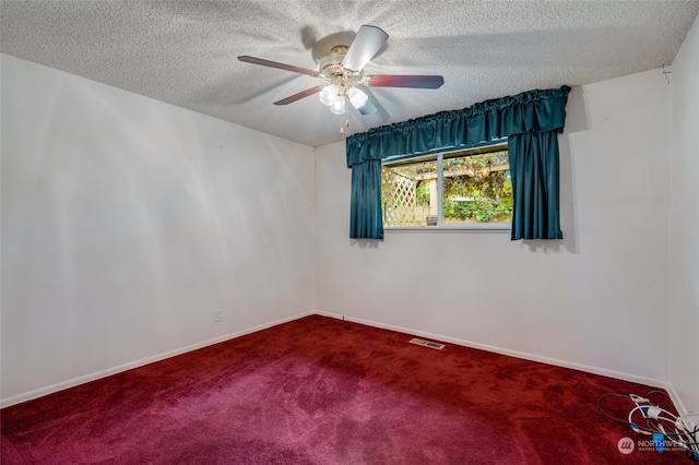 carpeted empty room featuring a textured ceiling and ceiling fan