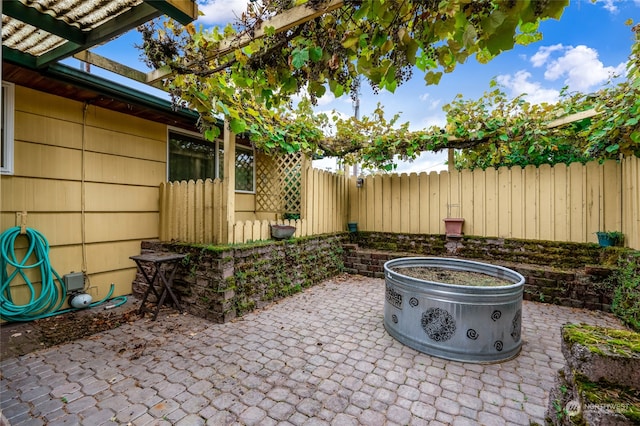 view of patio featuring a fire pit