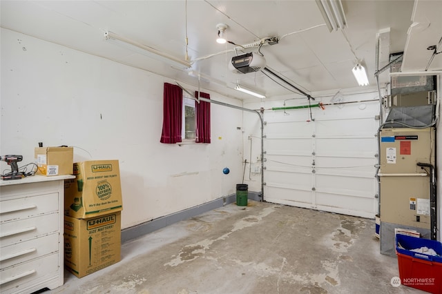 garage with a garage door opener and heating unit