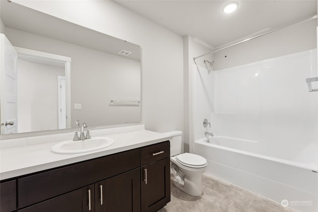 bathroom with vanity, toilet, visible vents, and shower / bathtub combination