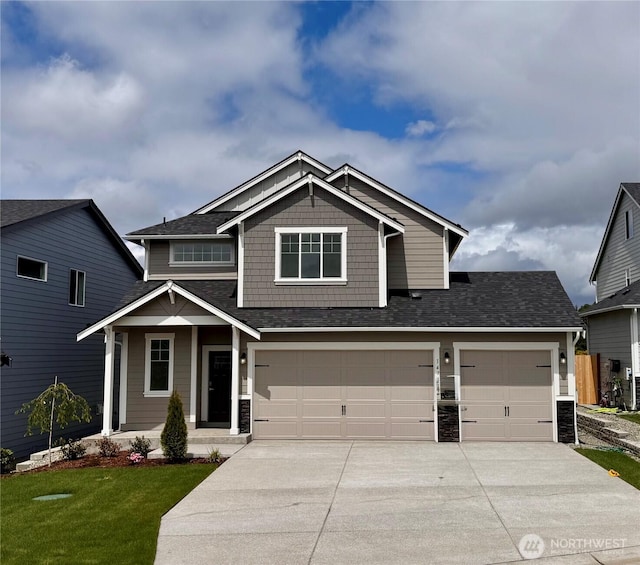14714 88th Way SE Unit 3, Yelm, WA 98597 - craftsman-style home with concrete driveway, roof with shingles, a front yard, and a garage