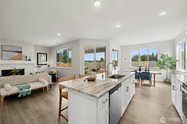 14714 88th Way SE Unit 3, Yelm, WA 98597 - kitchen with dishwasher, plenty of natural light, light wood-style floors, and recessed lighting