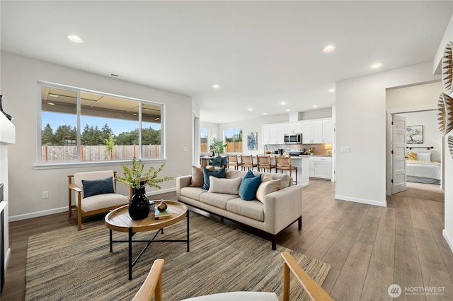 14714 88th Way SE Unit 3, Yelm, WA 98597 - living room with light wood-style floors, a fireplace, and recessed lighting