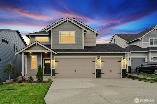 14714 88th Way SE Unit 3, Yelm, WA 98597 - craftsman inspired home featuring concrete driveway, stone siding, a yard, and an attached garage