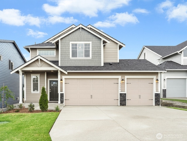14714 88th Way SE Unit 3, Yelm, WA 98597 - craftsman house with driveway, stone siding, a front lawn, and a garage
