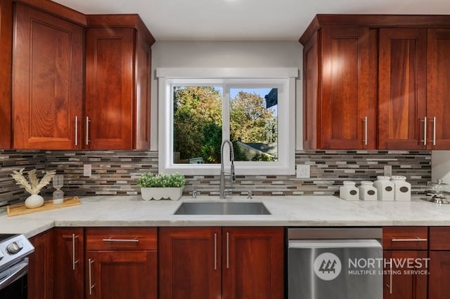 kitchen featuring decorative backsplash, light stone countertops, white stove, dishwasher, and sink