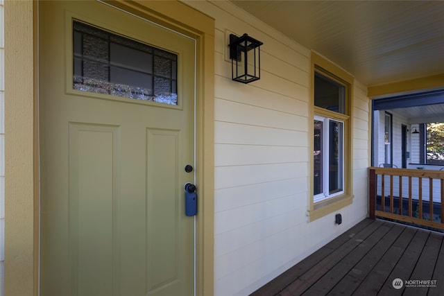 view of exterior entry featuring a porch