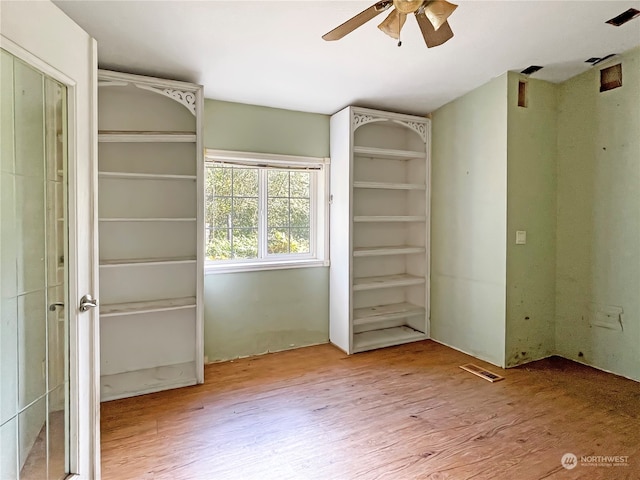 unfurnished bedroom featuring light hardwood / wood-style flooring and ceiling fan