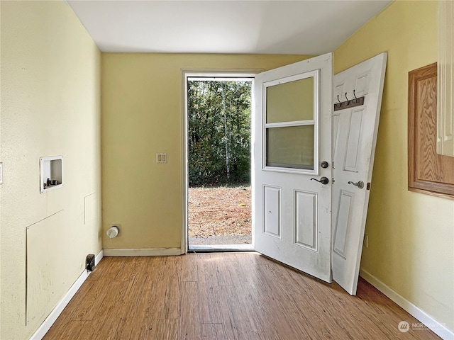 doorway with light wood-type flooring